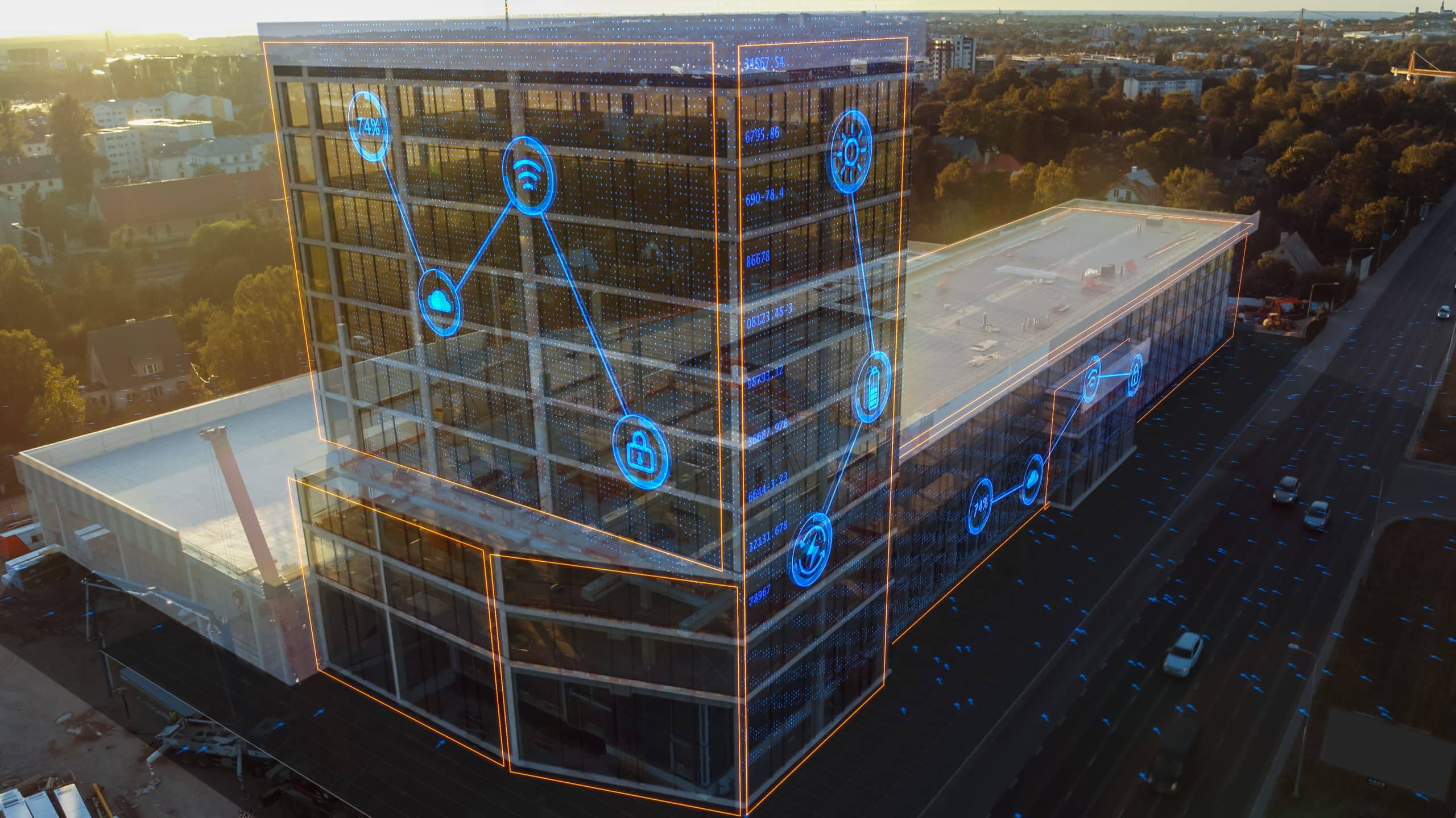 Drone image of a building with blue VFX overlay simulating smart building datapoints.