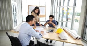 Business owner meeting with design-build construction team during project planning in Michigan