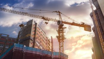 Commercial construction workers on a Michigan job site managing active building progress and project coordination