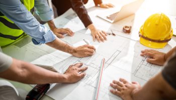 A business owner and our engineers planning a build
