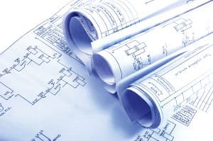Commercial project team reviewing building plans with long-term business needs in mind.