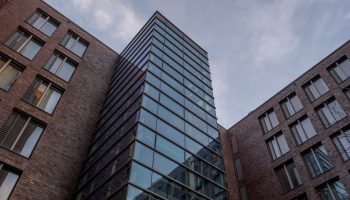 Modern commercial building with glass and brick exterior designed for long-term business use.
